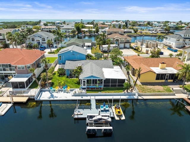 aerial view with a water view and a residential view