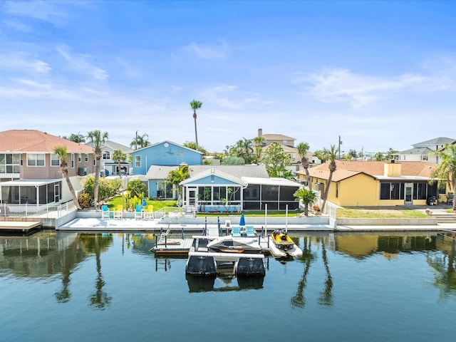 dock area featuring a water view and a residential view