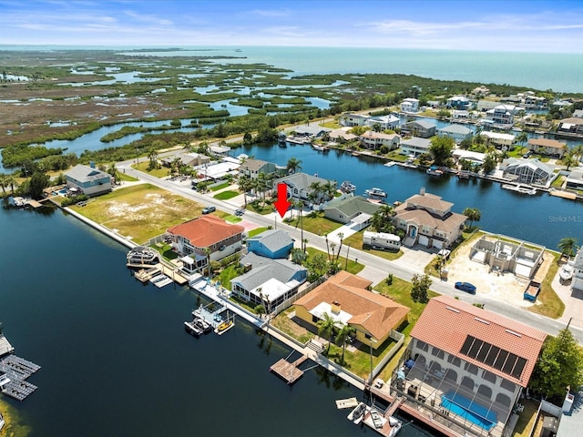 bird's eye view with a water view and a residential view