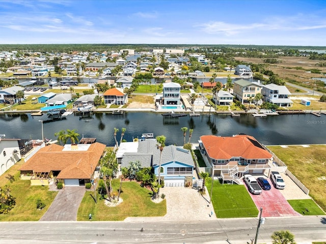 bird's eye view with a water view and a residential view