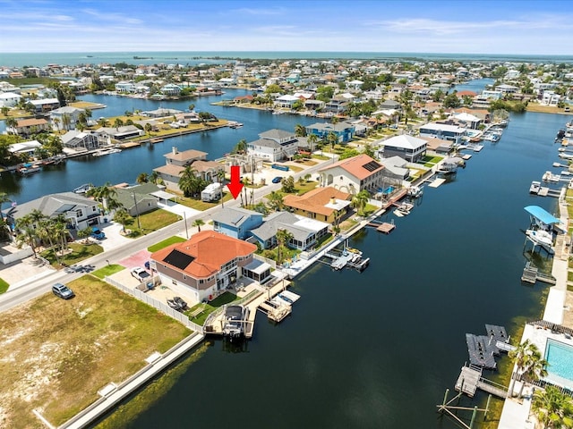 bird's eye view with a water view and a residential view