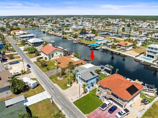 bird's eye view with a water view and a residential view