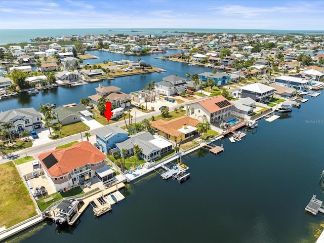 aerial view featuring a water view and a residential view
