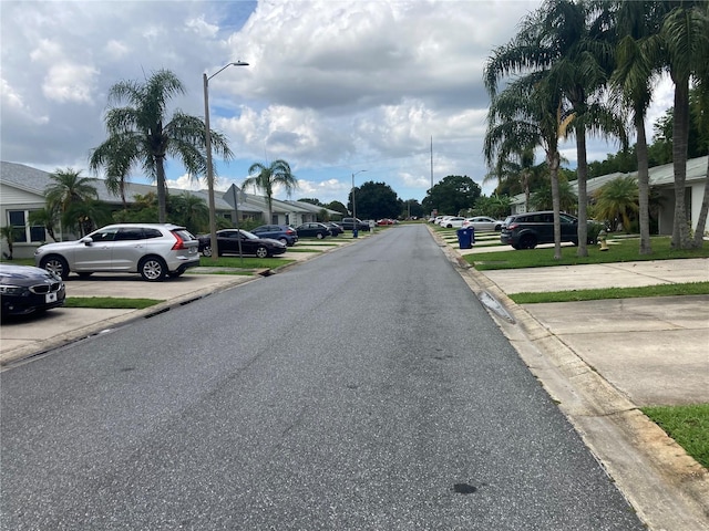 2850 Westmoreland Ct, New Port Richey, FL 34655 - view of asphalt street featuring street lighting, curbs, and a residential view