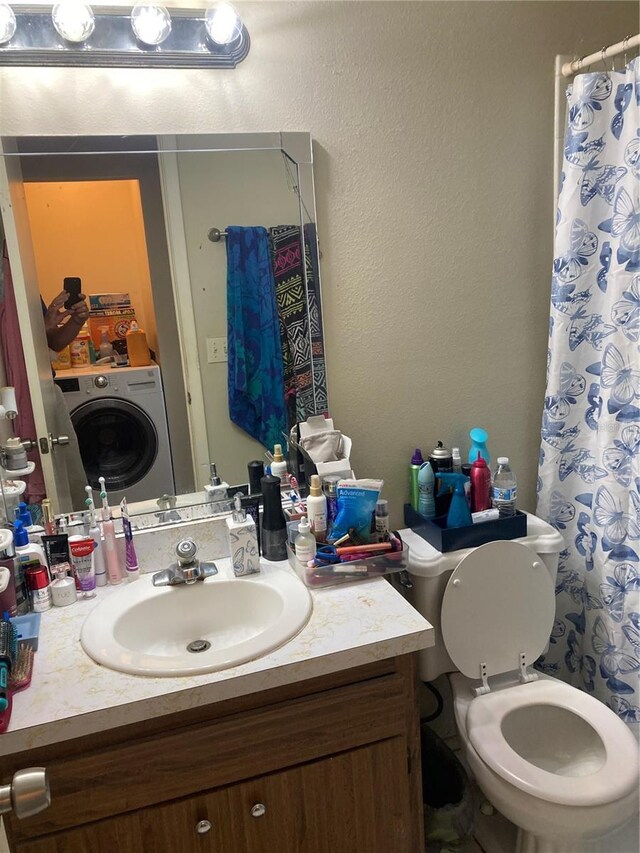 2850 Westmoreland Ct, New Port Richey, FL 34655 - bathroom featuring washer / clothes dryer, vanity, toilet, and curtained shower