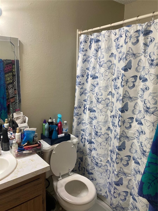 2850 Westmoreland Ct, New Port Richey, FL 34655 - full bathroom featuring vanity, toilet, a shower with curtain, and a textured wall