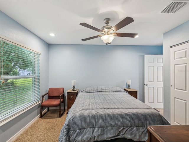 11512 Yellow Birch Ct, New Port Richey, FL 34654 - bedroom with light colored carpet, ceiling fan, baseboards, and recessed lighting