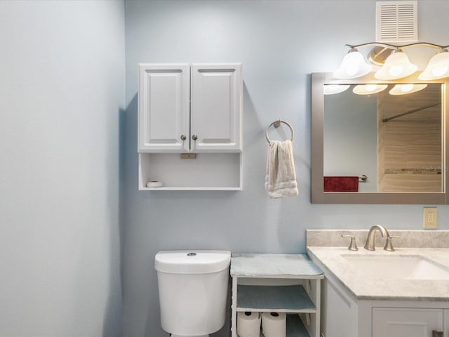 11512 Yellow Birch Ct, New Port Richey, FL 34654 - bathroom featuring vanity, toilet, and a chandelier
