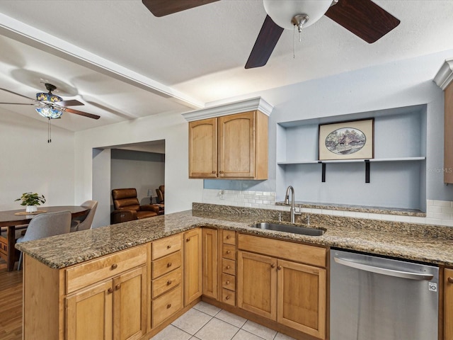 11512 Yellow Birch Ct, New Port Richey, FL 34654 - kitchen with stainless steel dishwasher, ceiling fan, open shelves, a sink, and a peninsula