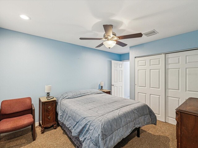 11512 Yellow Birch Ct, New Port Richey, FL 34654 - bedroom with light carpet, a closet, recessed lighting, and ceiling fan