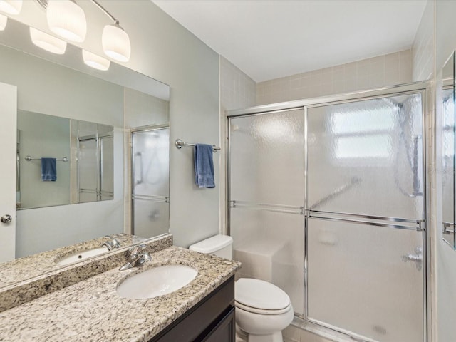 11512 Yellow Birch Ct, New Port Richey, FL 34654 - bathroom with toilet, a shower stall, and vanity