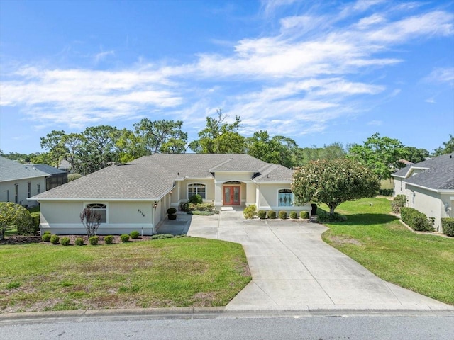9216 Tarleton Cir, Weeki Wachee, FL 34613 - ranch-style house with concrete driveway, an attached garage, a front lawn, and a shingled roof