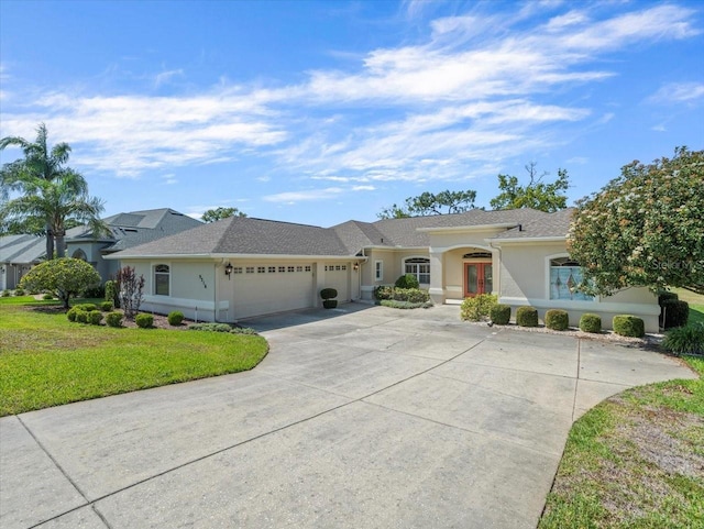 9216 Tarleton Cir, Weeki Wachee, FL 34613 - single story home with french doors, concrete driveway, a garage, stucco siding, and a front lawn