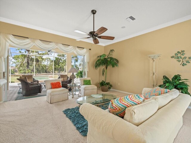9216 Tarleton Cir, Weeki Wachee, FL 34613 - carpeted living room featuring ornamental molding, baseboards, a ceiling fan, and visible vents