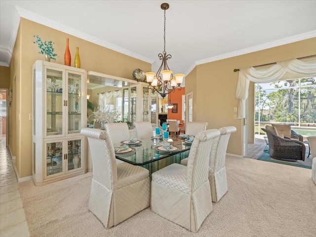 9216 Tarleton Cir, Weeki Wachee, FL 34613 - dining room with carpet flooring, an inviting chandelier, baseboards, and ornamental molding