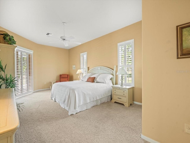 9216 Tarleton Cir, Weeki Wachee, FL 34613 - bedroom featuring light colored carpet, baseboards, visible vents, a ceiling fan, and access to outside