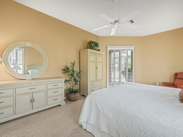 9216 Tarleton Cir, Weeki Wachee, FL 34613 - bedroom with light colored carpet, visible vents, and a ceiling fan