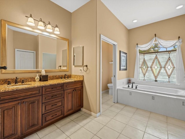 9216 Tarleton Cir, Weeki Wachee, FL 34613 - bathroom with a sink, toilet, a garden tub, and tile patterned floors
