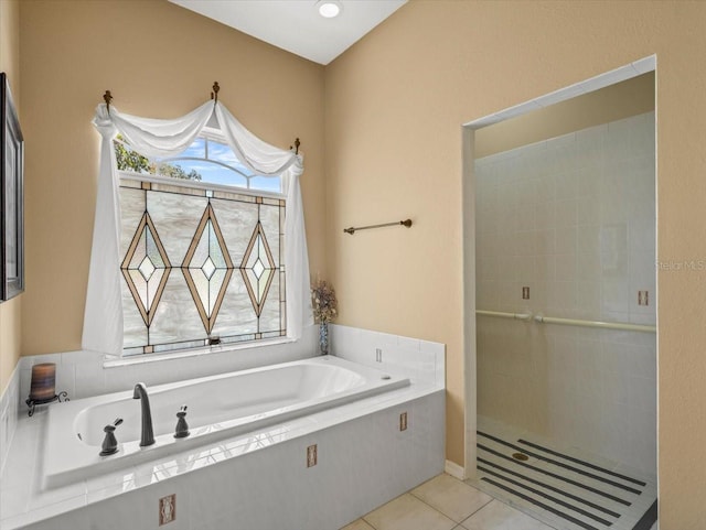 9216 Tarleton Cir, Weeki Wachee, FL 34613 - bathroom featuring a garden tub, tile patterned flooring, and tiled shower
