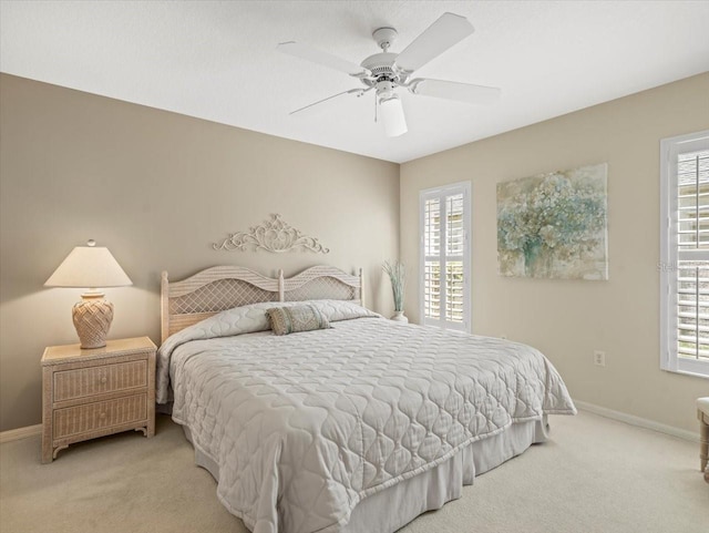 9216 Tarleton Cir, Weeki Wachee, FL 34613 - bedroom featuring multiple windows and carpet floors