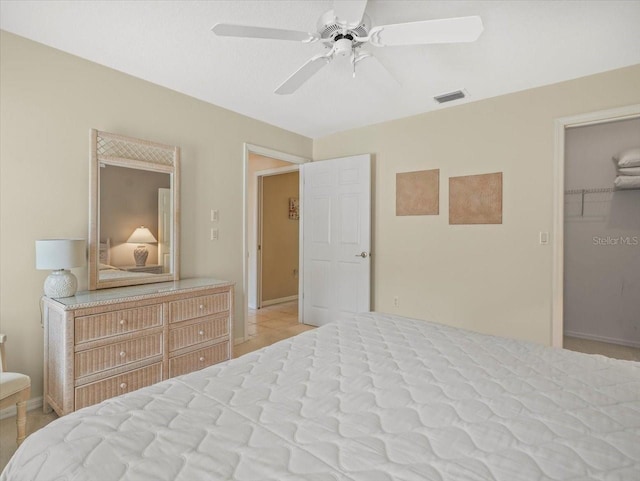 9216 Tarleton Cir, Weeki Wachee, FL 34613 - bedroom with a ceiling fan, baseboards, visible vents, and a walk in closet