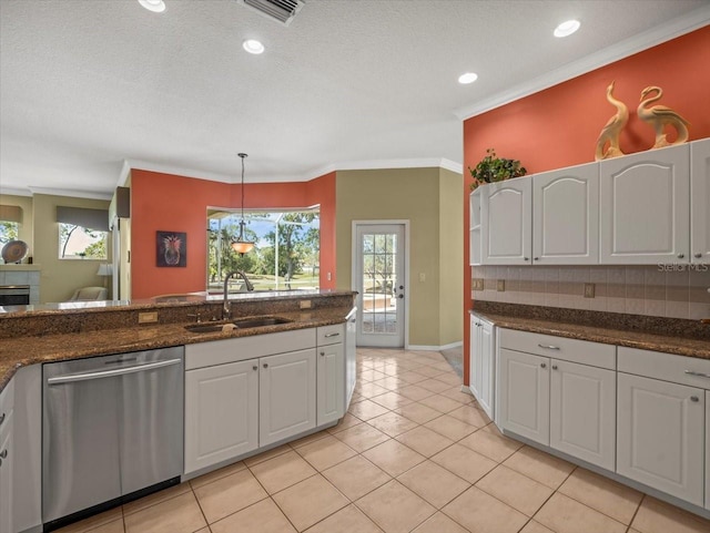 9216 Tarleton Cir, Weeki Wachee, FL 34613 - kitchen with a sink, visible vents, crown molding, white cabinets, and stainless steel dishwasher