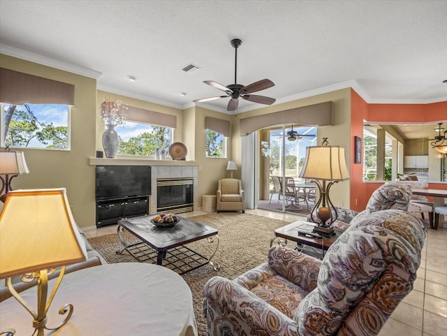9216 Tarleton Cir, Weeki Wachee, FL 34613 - living area with a healthy amount of sunlight, crown molding, visible vents, and ceiling fan
