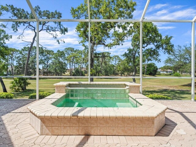 9216 Tarleton Cir, Weeki Wachee, FL 34613 - view of swimming pool featuring a yard, a lanai, and an in ground hot tub
