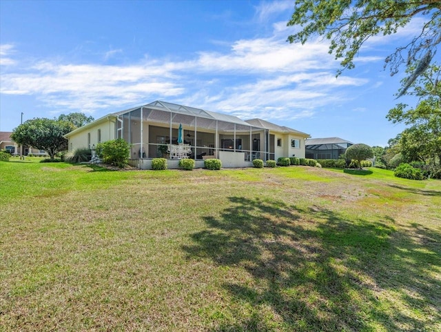 9216 Tarleton Cir, Weeki Wachee, FL 34613 - rear view of property with a yard and glass enclosure