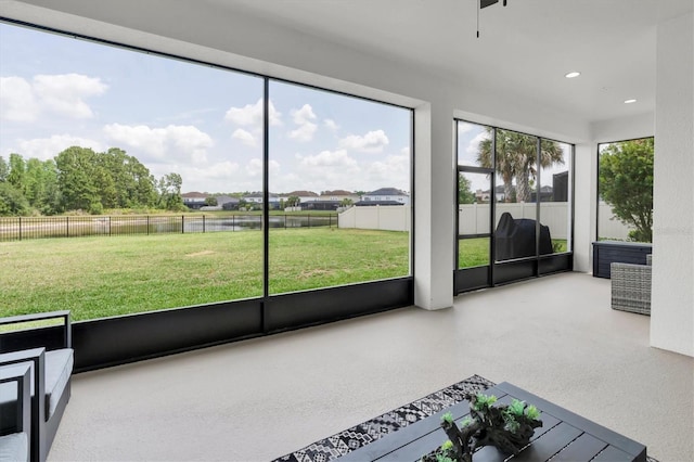 4188 Barbour Trl, Odessa, FL 33556 - unfurnished sunroom featuring a water view and ceiling fan
