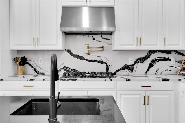 4188 Barbour Trl, Odessa, FL 33556 - kitchen with wall chimney exhaust hood, white cabinetry, and stone counters