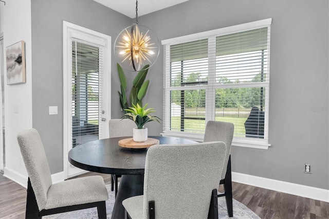 4188 Barbour Trl, Odessa, FL 33556 - dining room featuring plenty of natural light, a chandelier, dark wood-style floors, and baseboards