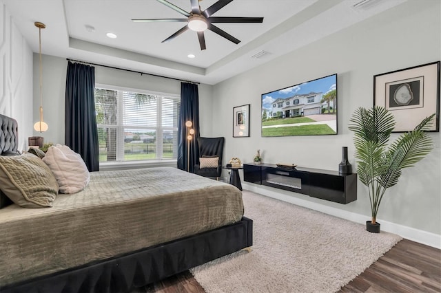 4188 Barbour Trl, Odessa, FL 33556 - bedroom featuring a raised ceiling, wood finished floors, baseboards, recessed lighting, and a ceiling fan