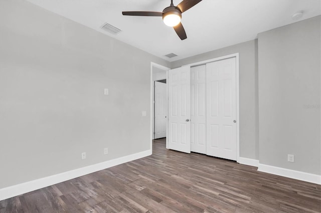 4188 Barbour Trl, Odessa, FL 33556 - unfurnished bedroom featuring baseboards, wood finished floors, a closet, and ceiling fan