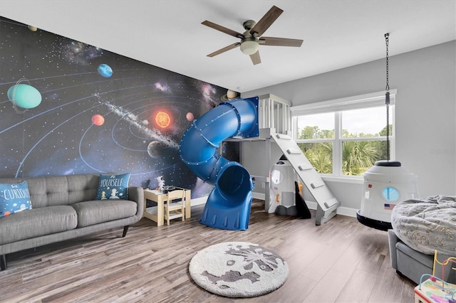 4188 Barbour Trl, Odessa, FL 33556 - playroom with wood finished floors, a ceiling fan, and baseboards