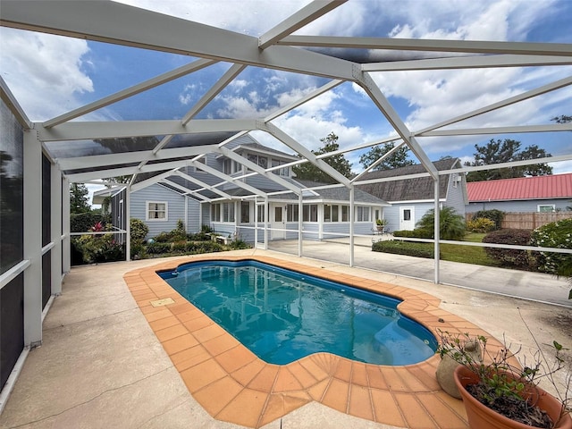 outdoor pool featuring a lanai and a patio