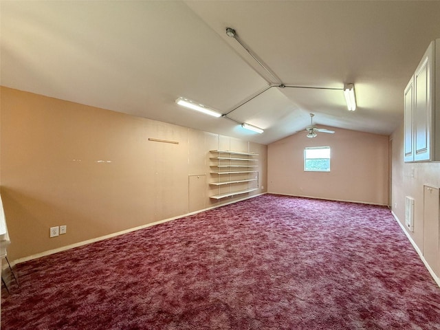 additional living space with ceiling fan, visible vents, carpet floors, and vaulted ceiling