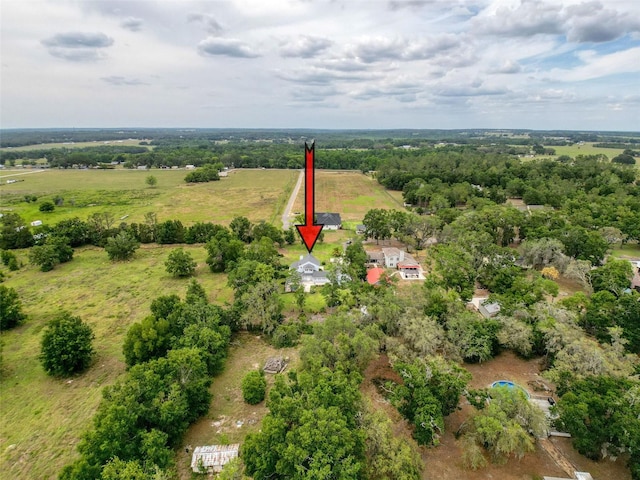 birds eye view of property featuring a rural view