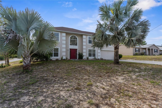 6440 Curtiss Ln, Spring Hill, FL 34609 - view of front facade with an attached garage, concrete driveway, and stucco siding