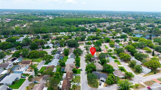 aerial view of property's location with nearby suburban area