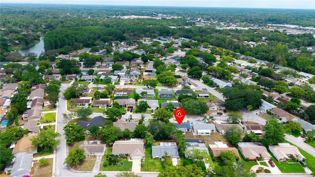aerial overview of property's location featuring nearby suburban area and a nearby body of water