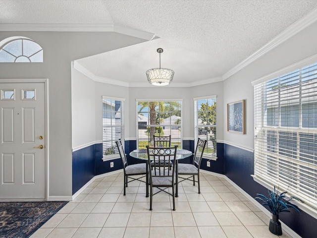 dining room featuring a textured ceiling, plenty of natural light, crown molding, baseboards, and light tile patterned floors