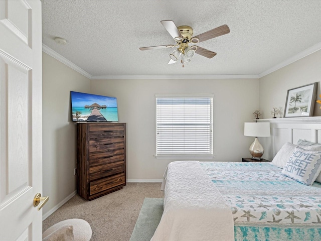 bedroom with carpet floors, ornamental molding, a ceiling fan, a textured ceiling, and baseboards