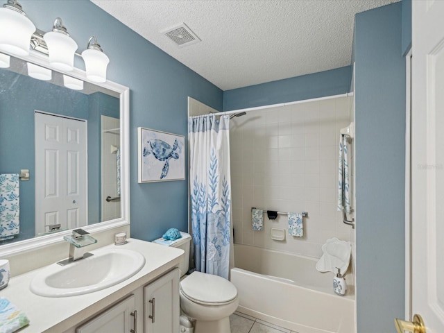 bathroom featuring a textured ceiling, vanity, shower / tub combo, toilet, and tile patterned flooring