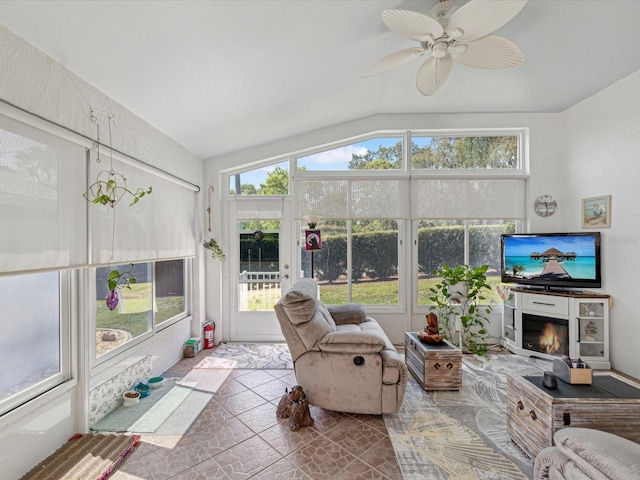 sunroom featuring lofted ceiling and tile patterned floors