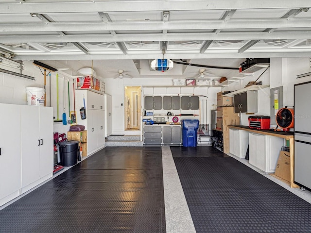 garage featuring electric panel and a garage door opener