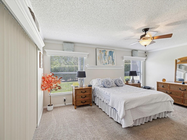 11342 Hollander Ave, Hudson, FL 34667 - carpeted bedroom featuring a textured ceiling, crown molding, a ceiling fan, and baseboards