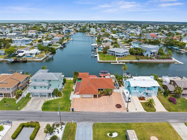 aerial view of residential area with a large body of water