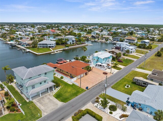 aerial perspective of suburban area with a nearby body of water