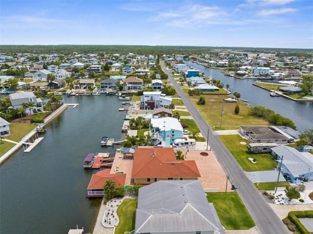 aerial view of residential area with a large body of water